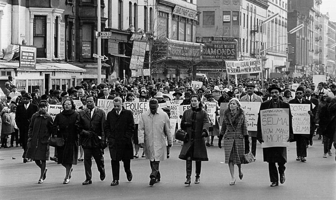 Civil rights advocates march in Harlem to protest recent racial violence in Alabama March 16, 1965. (Getty)
